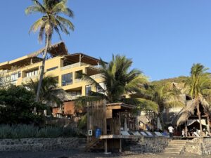 Beachfront building with palm trees on El Salvador's coast