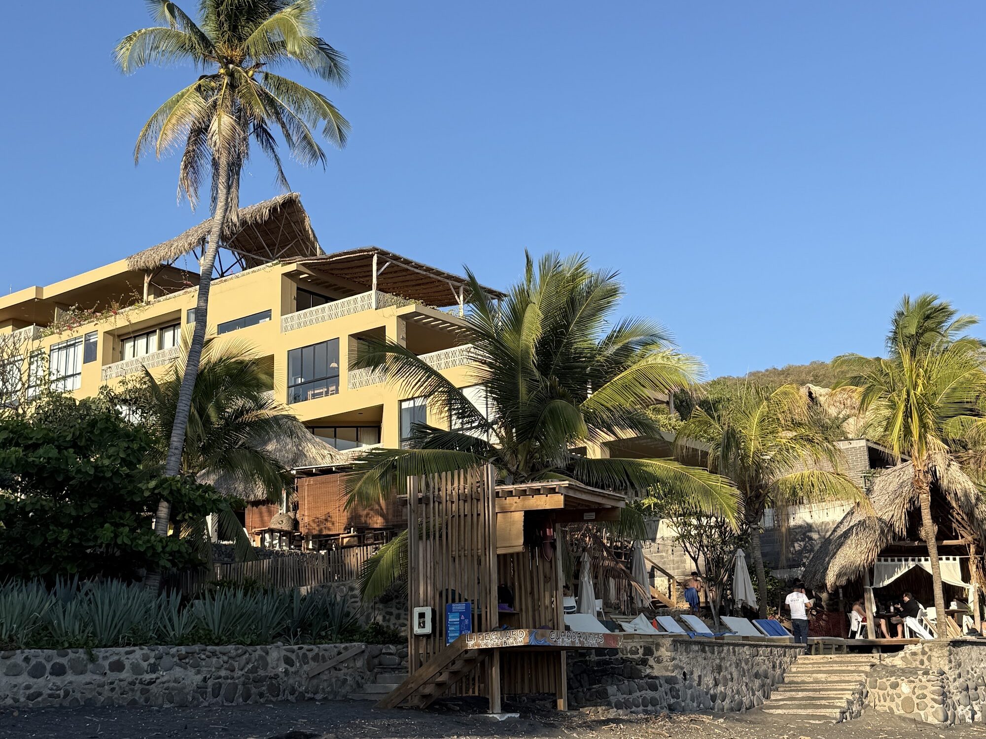 Beachfront building with palm trees on El Salvador's coast